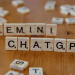 scrabble tiles spelling gemini and chatgpt